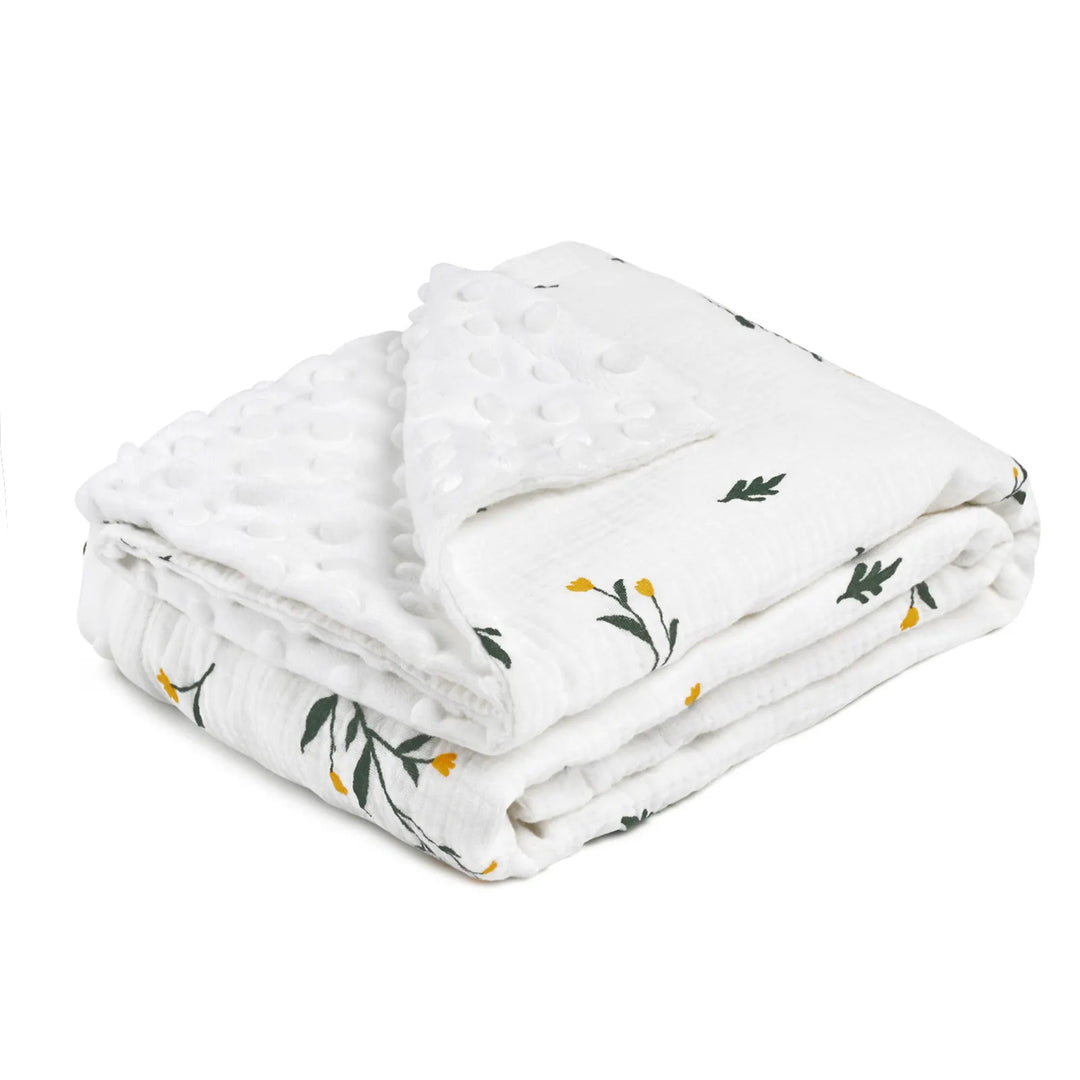 A folded baby blanket with a soft floral print, featuring a plush minky side for added comfort and warmth.