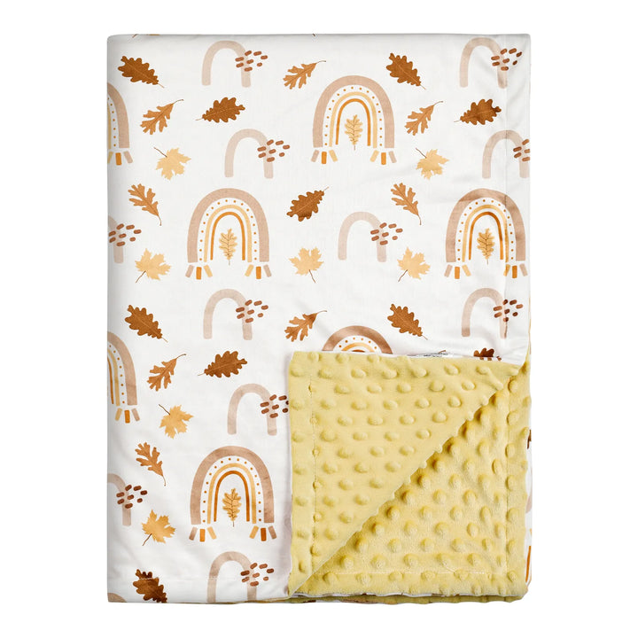 Fall-themed minky blanket with a rainbow and autumn leaves pattern, featuring a soft yellow reverse side. Cozy and warm, perfect for infants and toddlers.