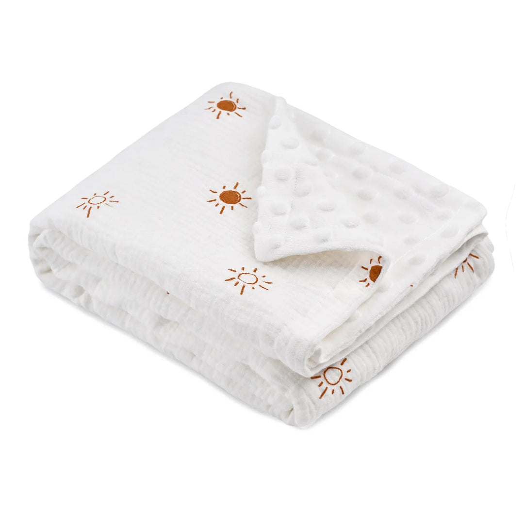 Folded ultra-soft Minky baby blanket with a sun pattern, hypoallergenic and breathable - perfect for newborns, infants, and toddlers.