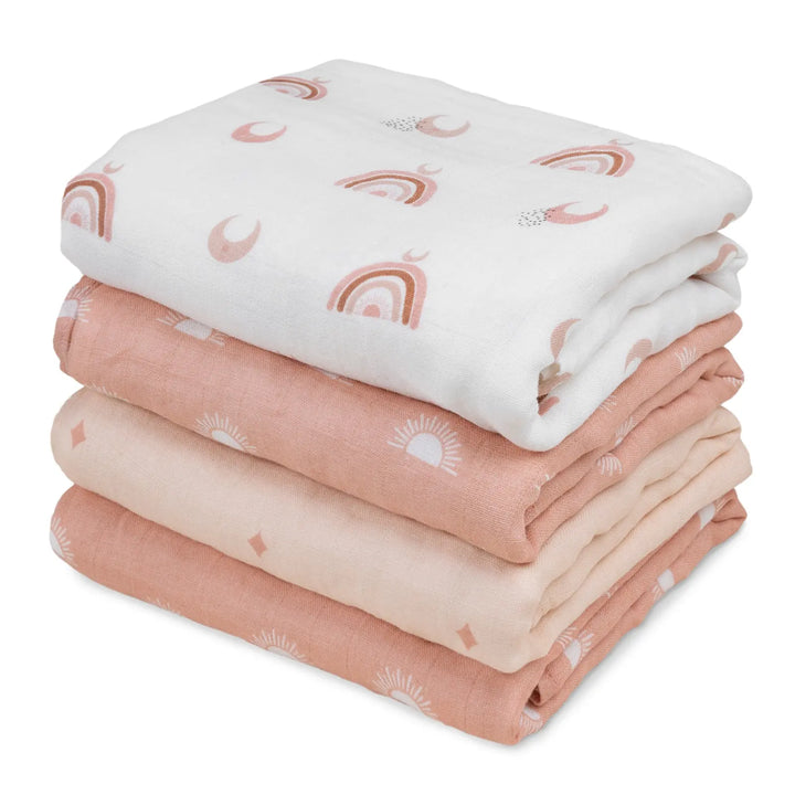 Stack of muslin swaddle blankets in warm earth tones featuring rainbow, sun, and diamond patterns. Soft and breathable, perfect for cozy swaddling.