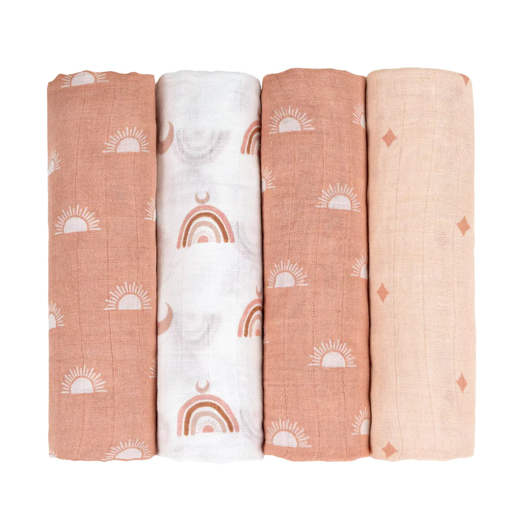 Set of four sunset-themed muslin swaddle blankets with sun, rainbow, and diamond patterns in warm earth tones. Soft and cozy for newborns and infants.